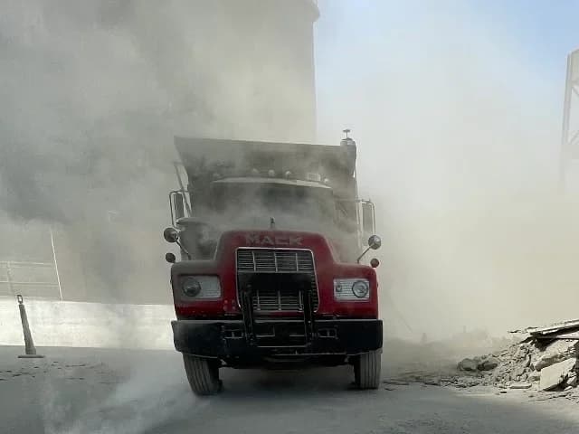 Triple Crown dump truck working at a demolition site
